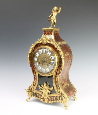 A French 19th Century striking mantel clock with gilt dial and Roman numerals contained in a red boulle shaped case surmounted by a figure of a standing cherub, the back plate of the movement marked BR, 48cm h x 22cm w x 12cm d