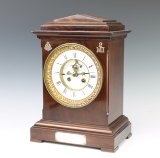 A French striking bracket clock with visible escapement, enamelled dial and Roman numerals, the back plate marked HP & Company, with silver presentation plaque relating to the East Lancashire Regt.  