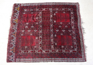 A red and white ground Hatchli rug with 7 rectangular medallions to the centre 235cm x 210cm (in wear)
