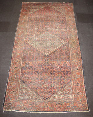 A Victorian blue and red ground Ferehen carpet with central medallion 400cm x 210cm