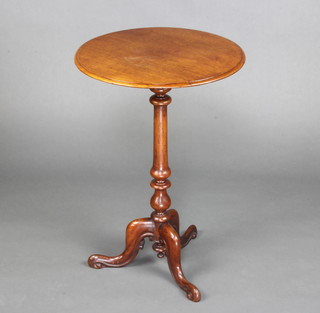 A Victorian circular mahogany snap top wine table raised on a turned column and tripod base 66cm h x 44cm diam.  