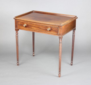 A Georgian style mahogany side/writing table with three-quarter gallery, fitted a frieze drawer and raised on turned and fluted supports 76cm h x 76cm w x 50cm d 