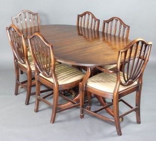 A Georgian style mahogany dining room suite comprising twin pillar D end extending dining table with extra leaf 74cm h x 181cm l x 213cm l when extended, together with a set of 6 shield back dining chairs 