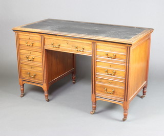 An Edwards and Roberts Victorian walnut desk with inset writing surface above 1 long and 6 short drawers, raised on turned supports 76cm h x 129cm w x 65cm d 