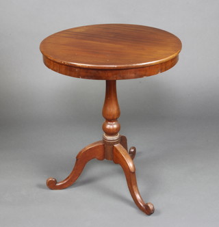 A Victorian circular mahogany snap top wine table with deep apron, raised on a turned column and tripod base 72cm h x 61cm diam. 