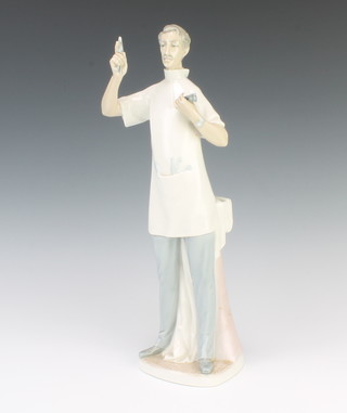 A Lladro figure of a dentist by the sculptor Salvatore Furio 34cm 
