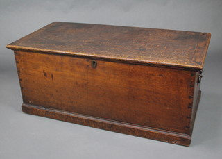 A Victorian rectangular oak coffer/trunk with hinged lid and iron drop handles raised on a platform base 50cm h x 117w x 58cm d 