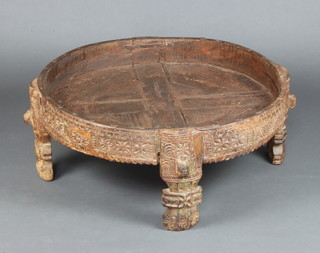 A circular Eastern hardwood jardiniere stand raised on 4 carved supports 30cm h x 81cm diam.  