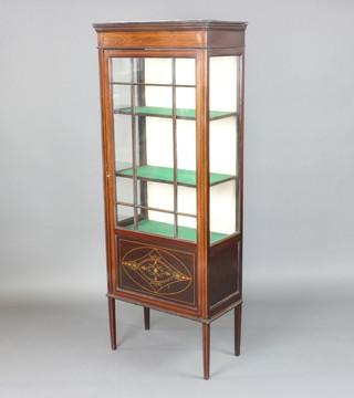 An Edwardian inlaid mahogany display cabinet fitted shelves enclosed by astragal glazed panelled doors raised on square tapered supports 154cm w x 61cm w x 30cm d 