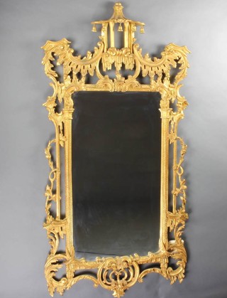 An Italian 20th Century Chinese Chippendale style rectangular plate mirror contained in a carved gilt and pierced wood frame 163cm x 80cm 