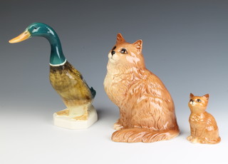 A Beswick brown cat 1867 20cm, a Royal Doulton kitten 9cm and a Beswick mallard duck 902 25cm  