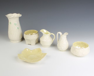 A Belleek leaf shaped dish with green mark 13cm, a  ditto circular bowl with green mark 9cm, a pedestal bowl with black mark 7cm, a small cream jug with green mark 7cm, ditto with black mark 9.5cm and a waisted vase with brown mark 16cm 