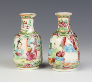 A pair of late 19th Century famille rose baluster vases decorated with panels of figures and insects 8cm 