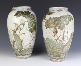 A pair of late 19th Century Japanese oviform vases decorated with birds amongst flowers with reticulated necks and 8 character mark to the bases 30cm 