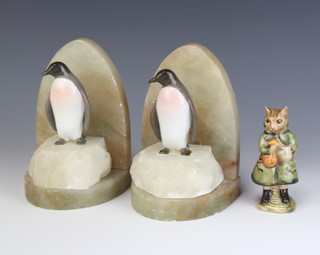 A pair of Copenhagen figures of penguins now mounted on onyx bookends 15cm and a Beatrix Potter Beswick figure Simpkin 10cm 