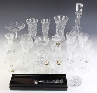 5 Waterford Crystal Kylemore wine glasses and a quantity of mixed pattern Waterford including small wines, 2 sherry glasses, a brandy balloon, a dessert bowl, 3 vases, decanter, 3 condiments, preserve pot and lid, sundae bowl, cake knife, tazza, paperweight, sherry, liqueur and 2 candlesticks 