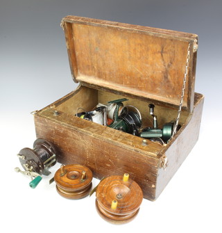 A Fonson wooden and brass centre pin fishing reel, a Starback wooden and brass centre pin reel, a Penn no.85, a Morritt's Intrepid reel x 2, a FRS reel, a Norris Shakespeare deluxe 2210, a Spin Fisher 55 and a Galion R reel, all contained in a wooden box 
