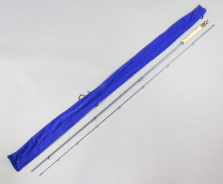 A Bob Church Power Wave 10'  7/8 line trout fishing rod in a blue cloth bag 