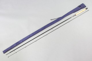 A Shimano Power Loop 10' fly fishing rod in a blue cloth bag 