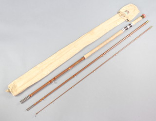 A Malbro Milbrolite 13' salmon fishing rod with 11/12 lines, marked Made in Scotland complete with original bag  