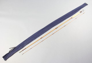 A 9' split cane 2 piece fly fishing rod in a blue cloth bag 