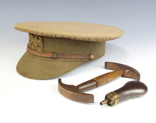 A copper and brass powder flask 12cm x 4cm together with a WWI General Service Corps peaked cap 