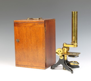 Watson and Sons, 313 High Holborn London, a Victorian brass single pillar microscope, the tube engraved awarded to Dr. A B Griffiths F.R.S. (Ed) FCS by the Canadian Meat Company for his essay on the significant value of their extract of beef 1865, contained in a mahogany case, the base fitted a drawer containing 19 slides  