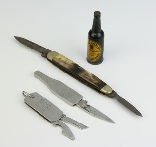 John Watts of Sheffield, a champagne advertising knife in the form of a bottle of champagne marked Champagne Dry Monopole the blade marked John Watts, a South of England Building Society pocket knife the blade marked Sheffield, a double bladed pocket knife with horn grip and a Guinness advertising lighter in the form of a bottle of Guinness
