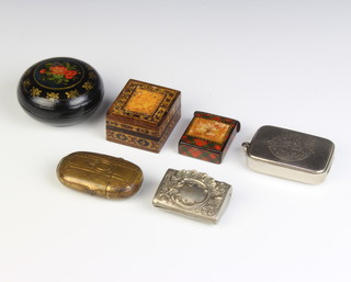 A Tunbridge Ware stamp box the lid decorated an Edwardian stamp 2cm x 4cm x 3cm, a square Carlton stamp box marked Carlton 3cm x 3cm x 3.5cm, a circular Soviet Russian lacquered box, an advertising vesta case for Harry Hall, an oval brass vesta case, an embossed metal stamp case  