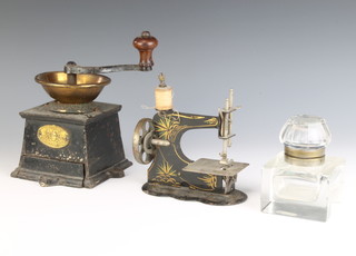 E Pugh & Company, a Victorian brass and iron coffee mill (top with tear), a child's tin plate sewing machine and a square glass inkwell 5.5cm x 7.5cm x 7.5cm 