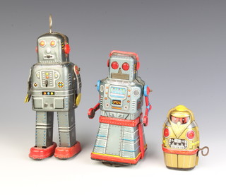 A 1960's Japanese tin plate clockwork robot marked S.Y, 1 other marked KO and 1 other marked Yone 