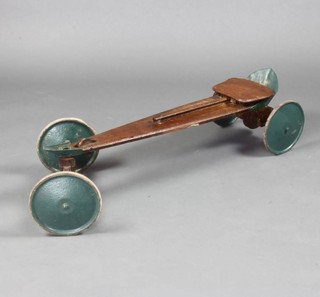 A wooden go-kart with metal wheels 26cm x 94cm x 32cm 