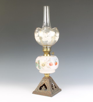 A Victorian opaque glass oil lamp reservoir raised on a pierced iron stand and  a pair of brass nut crackers in the form of a crocodile 
