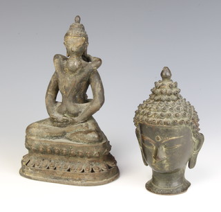 A 19th Century bronze portrait bust of Buddha 13cm x 5cm together with a bronze figure of a seated Buddha and embracing lady 18cm x 12cm x 9cm 