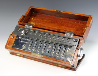 A Ludwig Spitz & Co Time is Money Stepped-Drum lever set calculator in a mahogany case circa 1907-1909.  Serial number 0756 on machine and 0938 on the case 