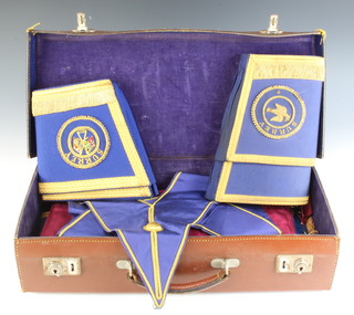Of Masonic interest, a leather case containing a Past Provincial Deacon's full dress apron, collar, collar jewel and gauntlets, a Provincial Grand Rank undressed apron, a Mark Master Masons apron and a pair of gauntlets