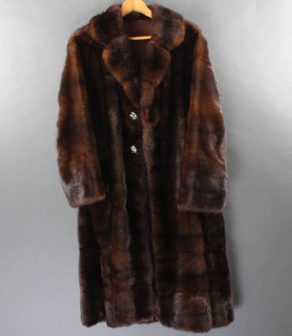 A lady's full length brown fur coat (large section of lining is coming loose) 