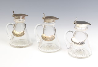A set of 3 silver mounted tapered glass spirit bottles with 3 silver whisky labels, Birmingham 1933