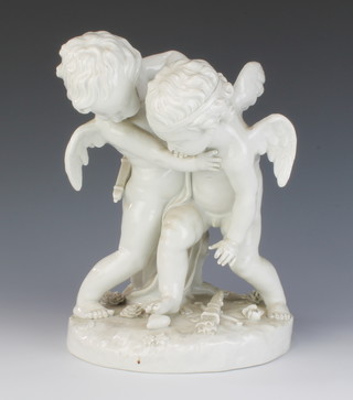 A Capodimonte white glazed group of 2 cavorting cherubs on a rocky floral base 30cm 