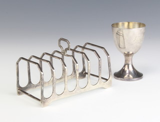 A silver 7 bar toast Birmingham 1913 and a ditto egg cup 116 grams 