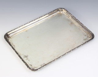 A rectangular silver dressing table tray with fancy rim 28cm x 21cm 360 grams