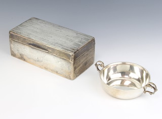 A silver 2 handled bowl Sheffield 1938 and a rectangular silver engine turned cigarette box 
