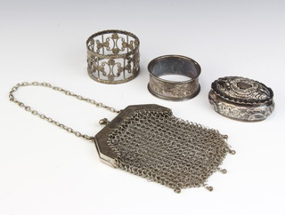 A Victorian oval repousse silver box Birmingham 1896 6cm, a mesh purse and 2 napkin rings 