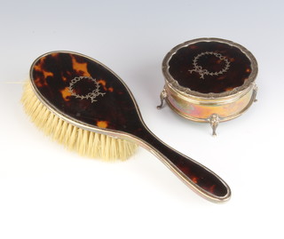A silver and tortoiseshell picquet trinket box with ribbon decoration together with a ditto hairbrush Birmingham 1925 
