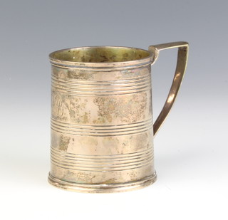A George III silver mug with ribbed decoration and engraved monogram London 1809, 134 grams 