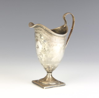 A George III silver cream jug chased with a laurel, London 1796, 96 grams