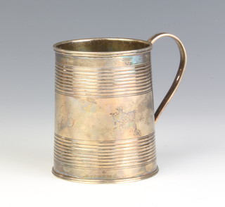 A George III silver mug with ribbed decoration and engraved monogram London 1810, 143 grams
