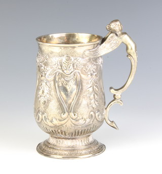 A William IV repousse silver mug with wing caryatid handle, the body decorated with masks and fruits and scrolls, London 1832, maker George Smith II and Thomas Hayter, 348 grams 