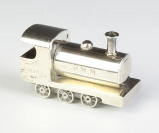 A silver model of a steam locomotive, with engraved monogram, London 1982, maker Sarah Jones, 36 grams  