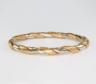 A 9ct 2 colour gold bangle 14.2 grams